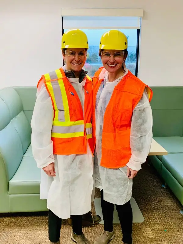 two workers in protective gear