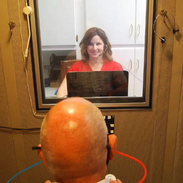 heather conducting a hearing test