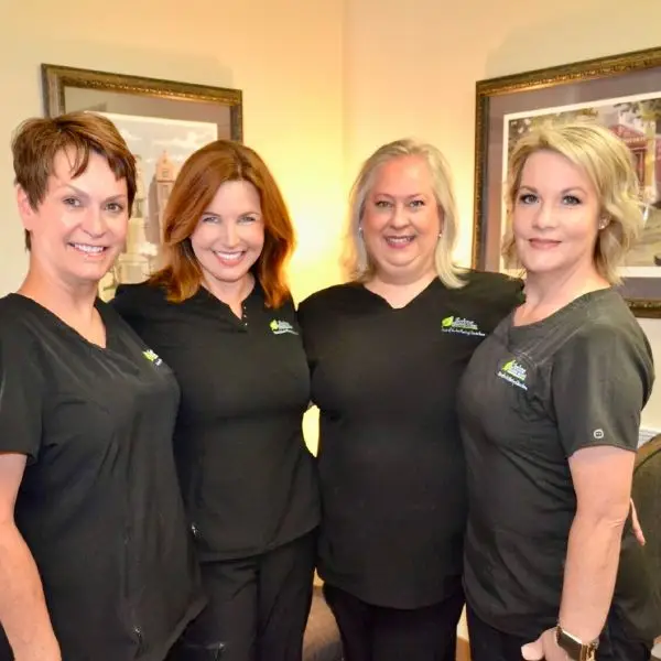 lifetime employees standing together and smiling